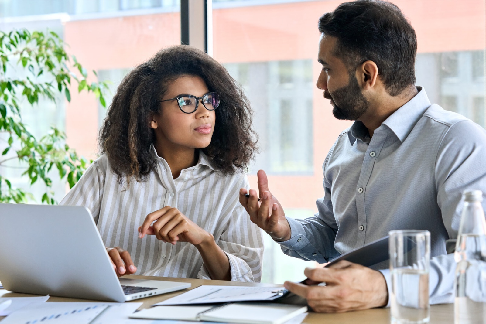 Financial coaching session at a laptop